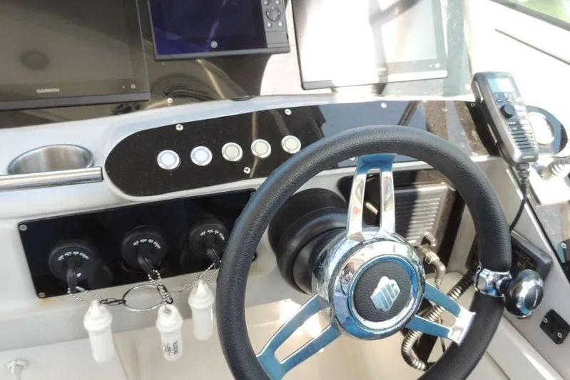  Yacht Photos Pics Dashboard of a 2001 Formula 400 Super Sport boat with steering wheel and controls.