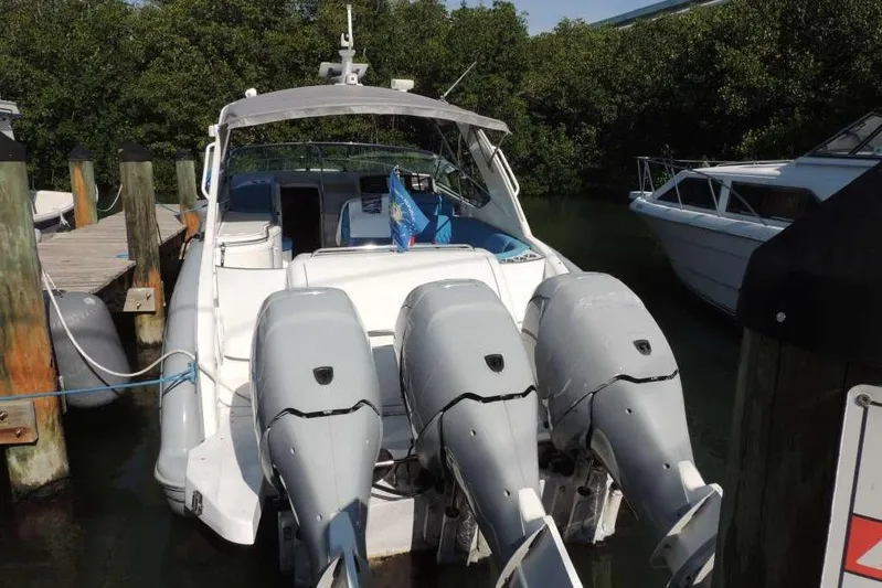  Yacht Photos Pics 2001 Formula 400 Super Sport boat docked with triple outboard engines.
