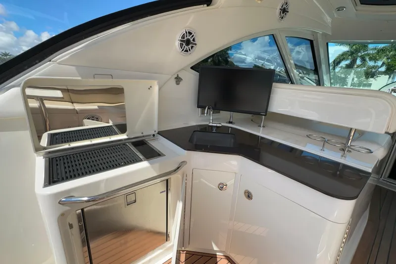  Yacht Photos Pics Luxurious 2012 Sea Ray 470 Sundancer yacht interior with modern kitchenette and sleek design.
