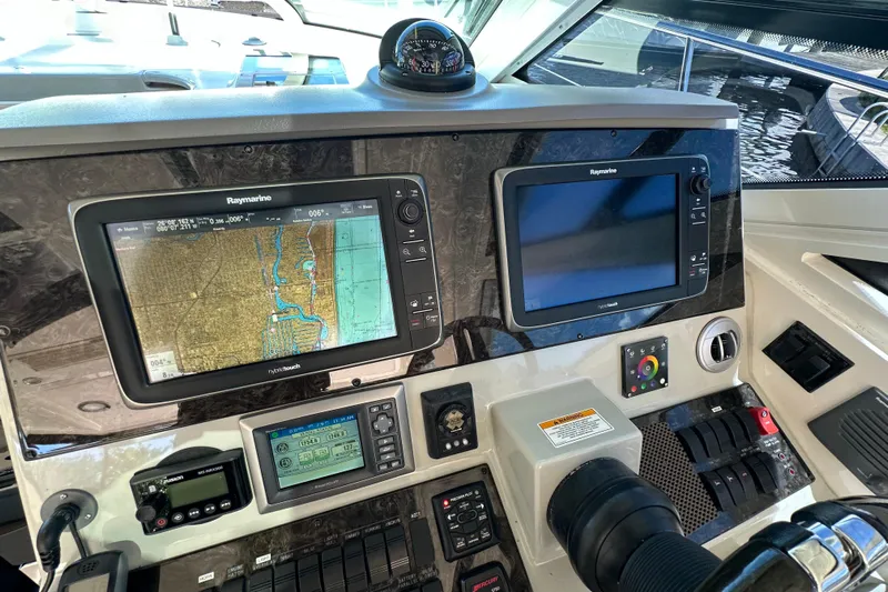  Yacht Photos Pics Control panel of a 2012 Sea Ray 470 Sundancer with navigation screens and instruments.