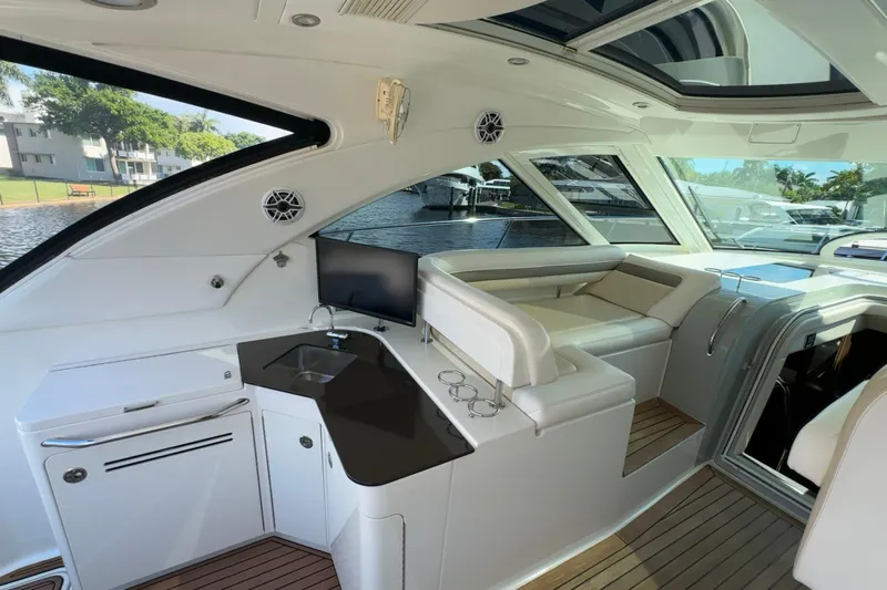  Yacht Photos Pics Luxurious interior of a 2012 Sea Ray 470 Sundancer yacht with sleek seating and modern amenities.