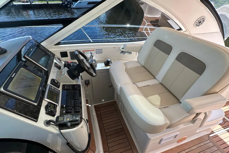  Yacht Photos Pics Helm of 2012 Sea Ray 470 Sundancer with dual seats and navigation controls.