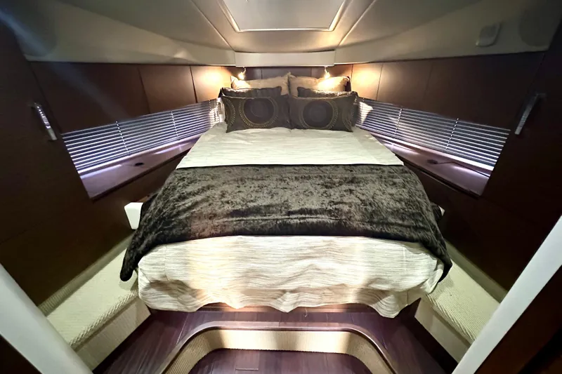  Yacht Photos Pics Luxurious bedroom interior of 2012 Sea Ray 470 Sundancer yacht with elegant bedding.