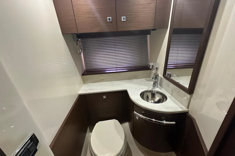  Yacht Photos Pics Luxurious bathroom in 2012 Sea Ray 470 Sundancer yacht with modern fixtures and elegant design.