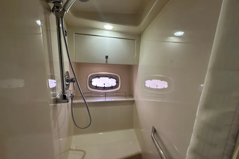  Yacht Photos Pics Shower area in 2012 Sea Ray 470 Sundancer yacht with window and modern fixtures.