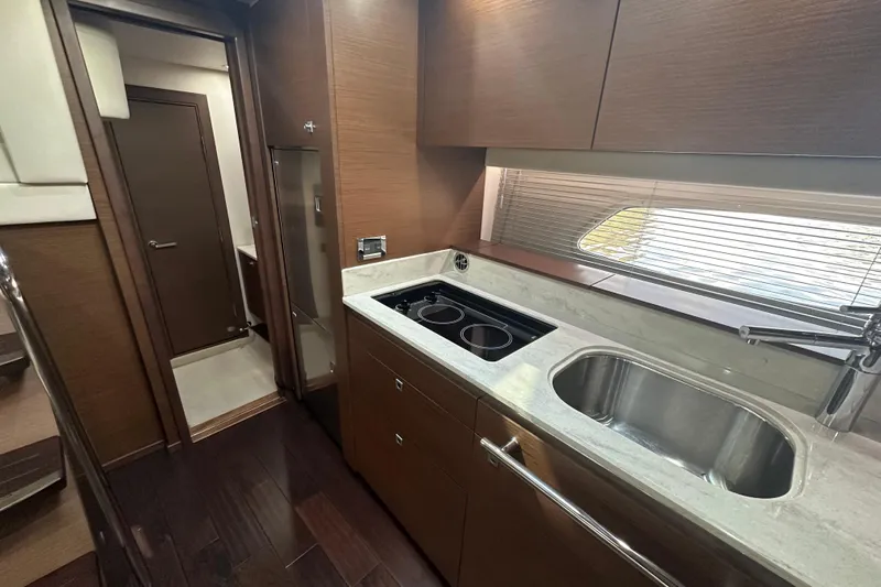  Yacht Photos Pics Luxurious kitchen interior of 2012 Sea Ray 470 Sundancer yacht with modern amenities.