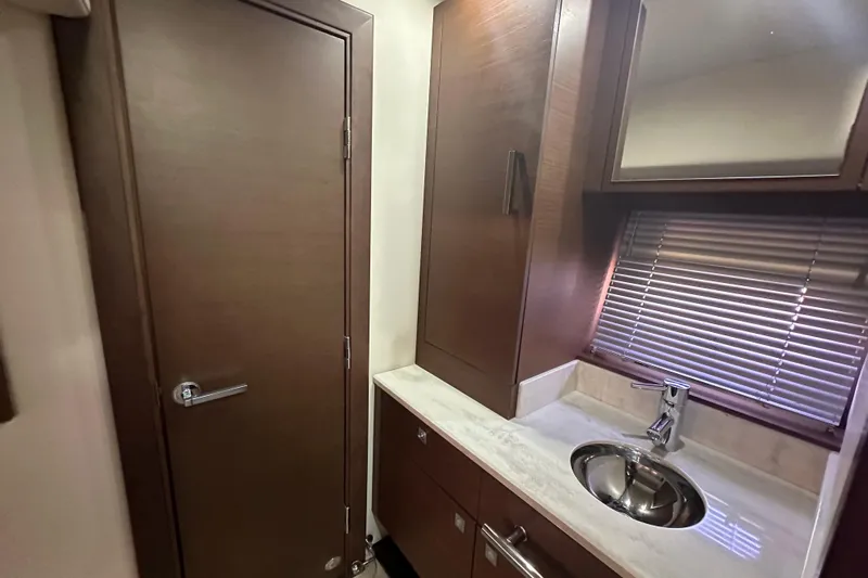  Yacht Photos Pics Luxurious bathroom interior of 2012 Sea Ray 470 Sundancer yacht with modern fixtures.