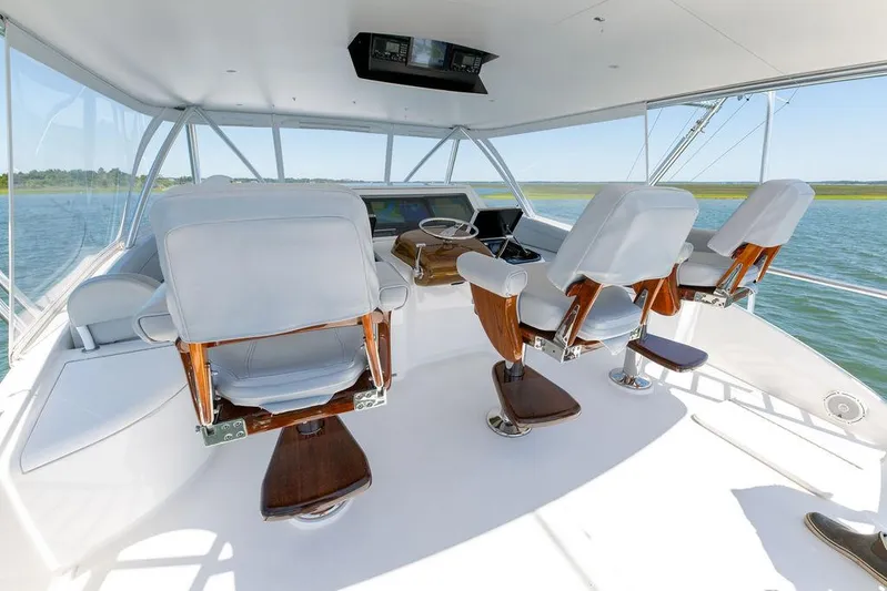 Sea I Sea Yacht Photos Pics 2017 Viking 72 Convertible yacht helm station with white captain chairs.