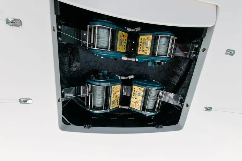 Sea I Sea Yacht Photos Pics 2017 Viking 72 Convertible fishing reel system in boat compartment.