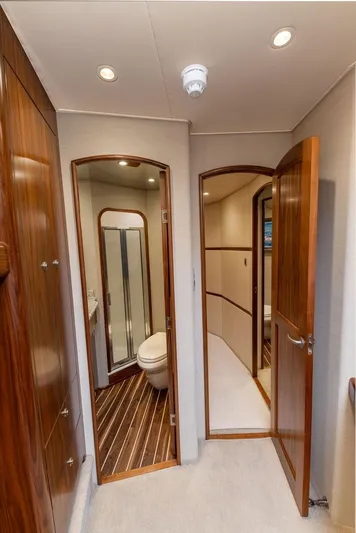 Sea I Sea Yacht Photos Pics 2017 Viking 72 Convertible yacht interior with wooden doors and bathroom.