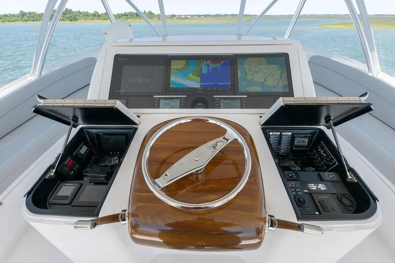 Sea I Sea Yacht Photos Pics 2017 Viking 72 Convertible yacht helm with advanced navigation systems and wooden steering wheel.