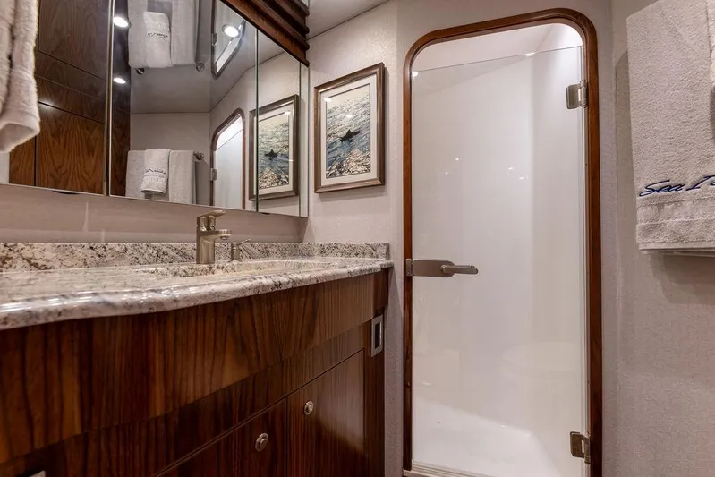 Sea I Sea Yacht Photos Pics Luxurious bathroom in a 2017 Viking 72 Convertible yacht with granite countertop.