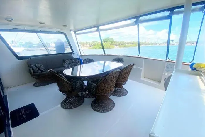 Sea Sharp Yacht Photos Pics Spacious 1990 Viking Motor Yacht interior with elegant seating and panoramic windows.