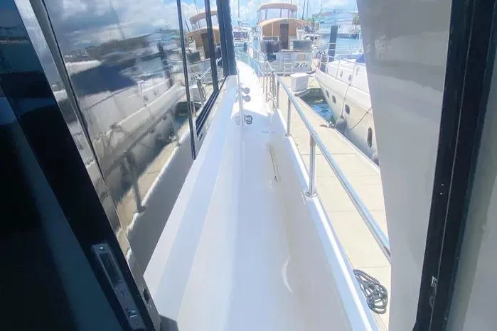 Sea Sharp Yacht Photos Pics 1990 Viking Motor Yacht deck view with marina background.