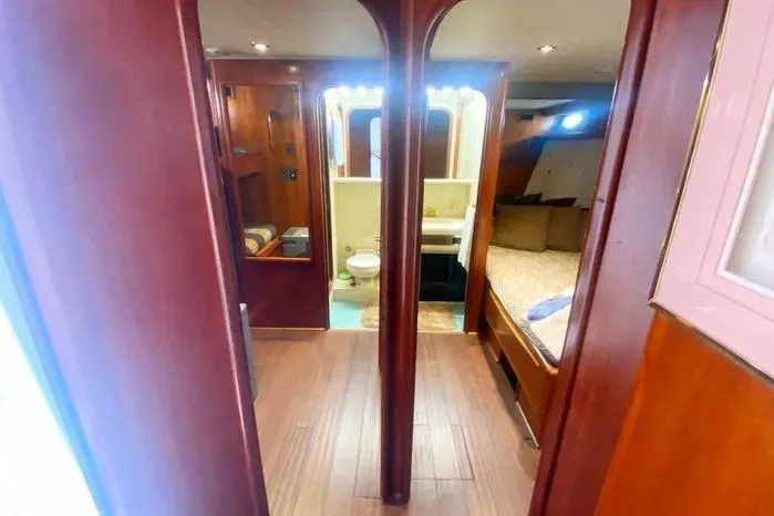 Sea Sharp Yacht Photos Pics Interior of 1990 Viking Motor Yacht with wood paneling and cozy cabin.