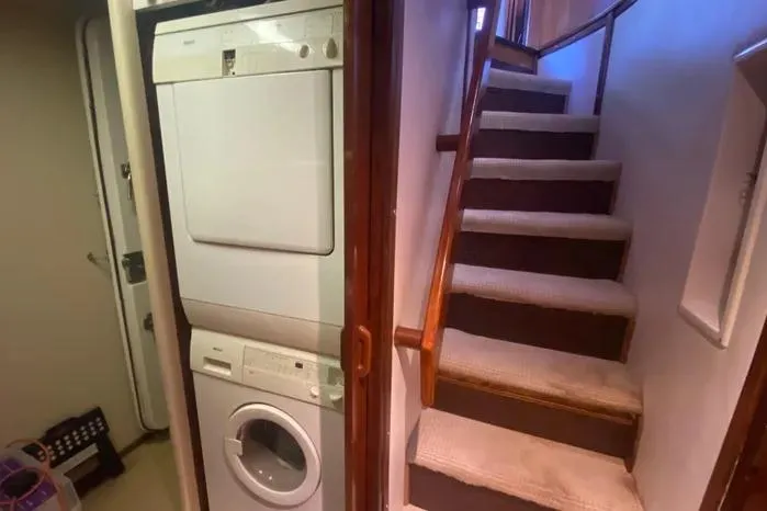Sea Sharp Yacht Photos Pics Laundry area and staircase inside a 1990 Viking Motor Yacht.