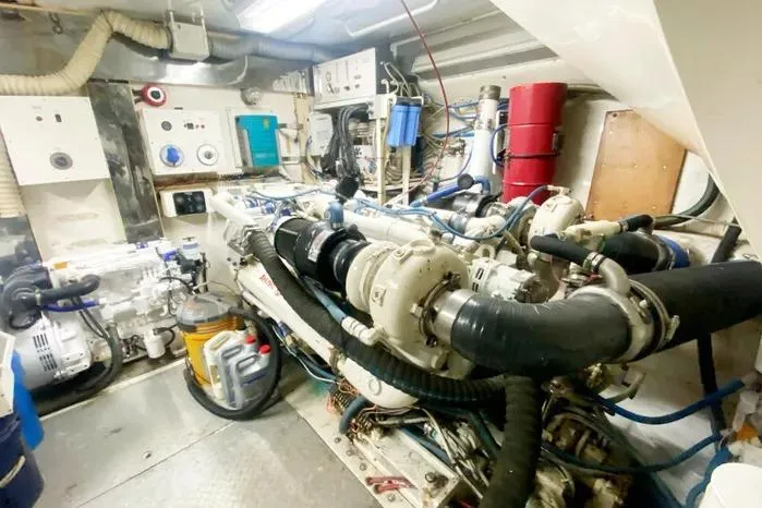 Sea Sharp Yacht Photos Pics Engine room of a 1990 Viking Motor Yacht, showcasing complex machinery and equipment.