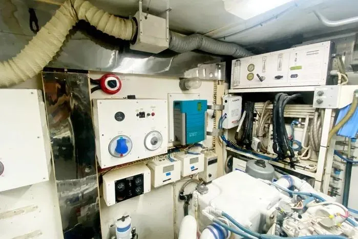 Sea Sharp Yacht Photos Pics Engine room of a 1990 Viking Motor Yacht with various control panels and equipment.