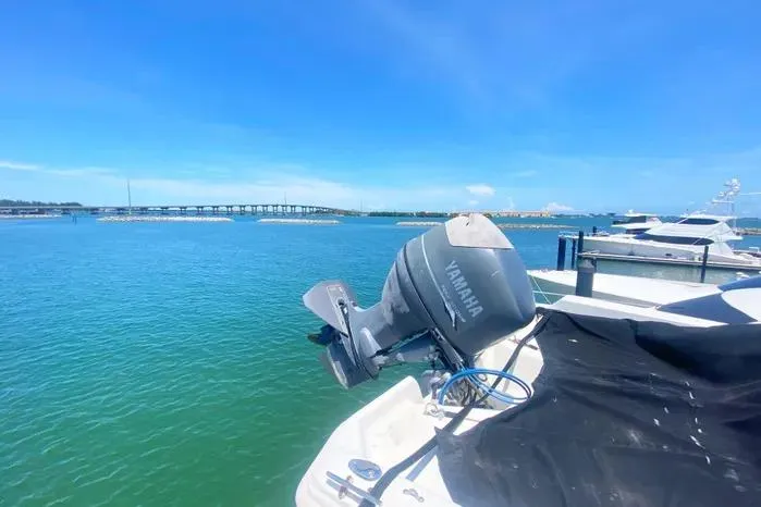 Sea Sharp Yacht Photos Pics 1990 Viking Motor Yacht with Yamaha engine, docked by a scenic waterfront.