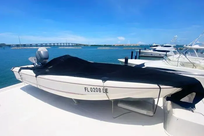 Sea Sharp Yacht Photos Pics Covered Viking motor yacht from 1990 docked by the sea with a scenic bridge view.