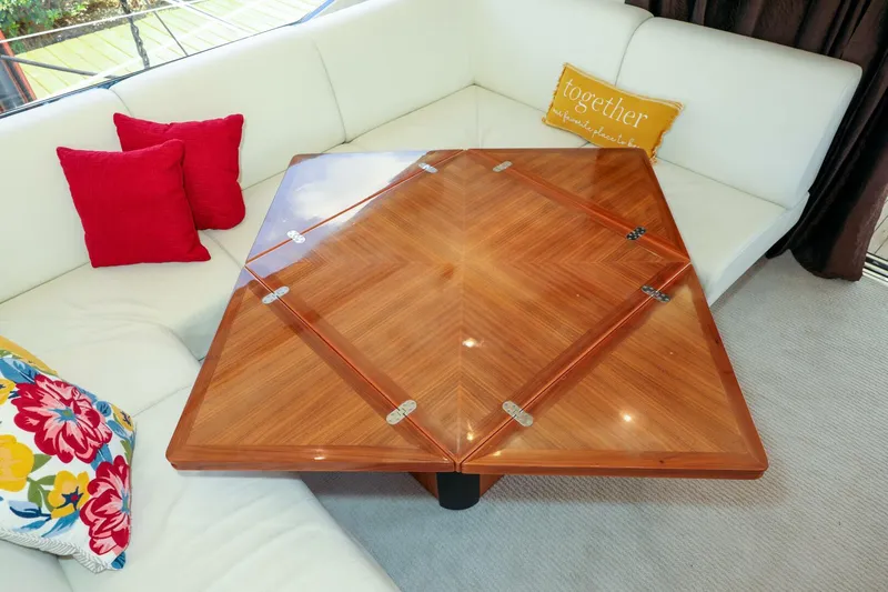 Currency Yacht Photos Pics Luxurious Sunseeker 60 Manhattan 2009 yacht interior with elegant wooden table and plush seating.