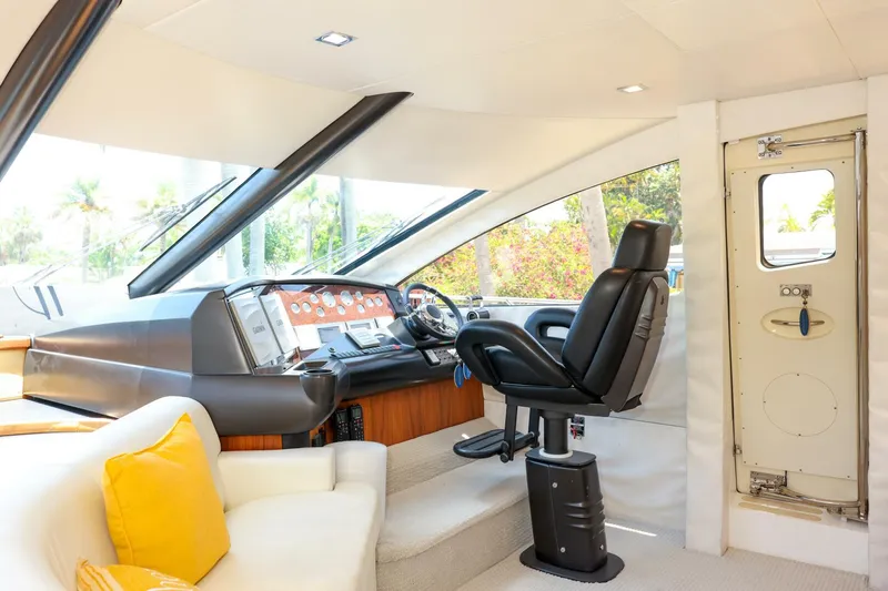 Currency Yacht Photos Pics Interior of 2009 Sunseeker 60 Manhattan yacht with helm and seating area.