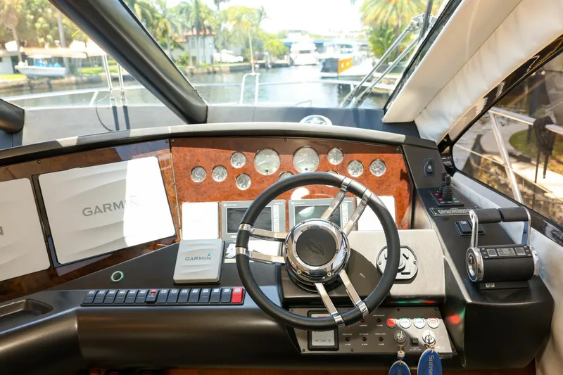 Currency Yacht Photos Pics Helm of 2009 Sunseeker 60 Manhattan yacht with Garmin navigation system.