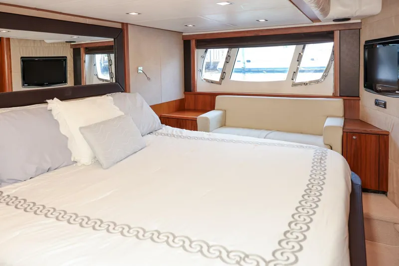 Currency Yacht Photos Pics Luxurious bedroom interior of 2009 Sunseeker 60 Manhattan yacht with elegant furnishings.