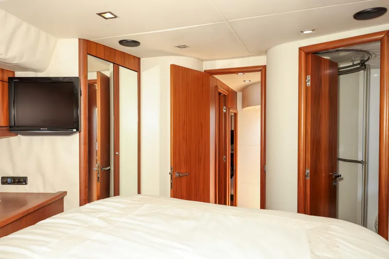 Currency Yacht Photos Pics Interior of 2009 Sunseeker 60 Manhattan yacht, featuring wood finishes and modern amenities.