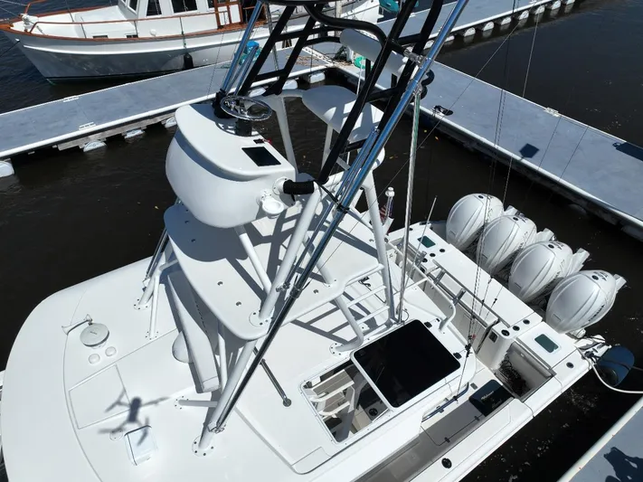 Happy Hour Yacht Photos Pics 2022 Pursuit s428 boat docked, aerial view showing deck and engines.