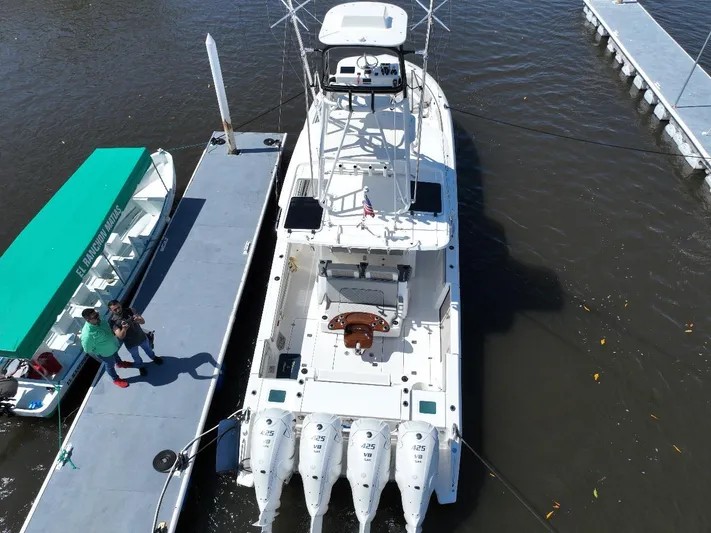 Happy Hour Yacht Photos Pics Aerial view of 2022 Pursuit s428 boat docked with four engines.