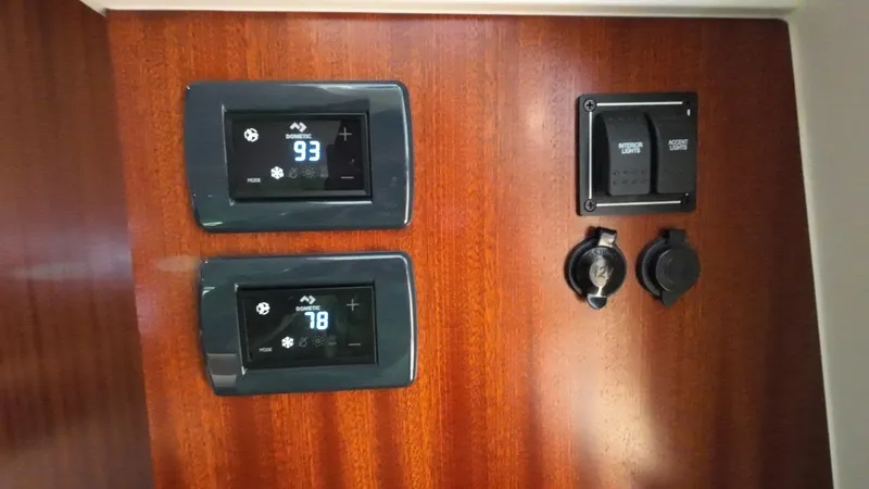 Happy Hour Yacht Photos Pics Control panel on 2022 Pursuit s428 boat with digital displays and switches.