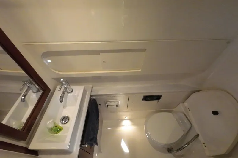 Happy Hour Yacht Photos Pics 2022 Pursuit s428 boat bathroom with sink and toilet.