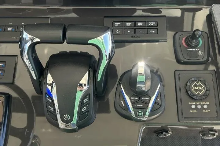 Happy Hour Yacht Photos Pics Control panel of 2022 Pursuit s428 boat with throttle and joystick controls.