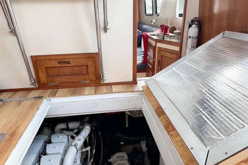 Mirage Yacht Photos Pics Interior of 1999 Nordic 32 boat showing engine compartment and cabin area.