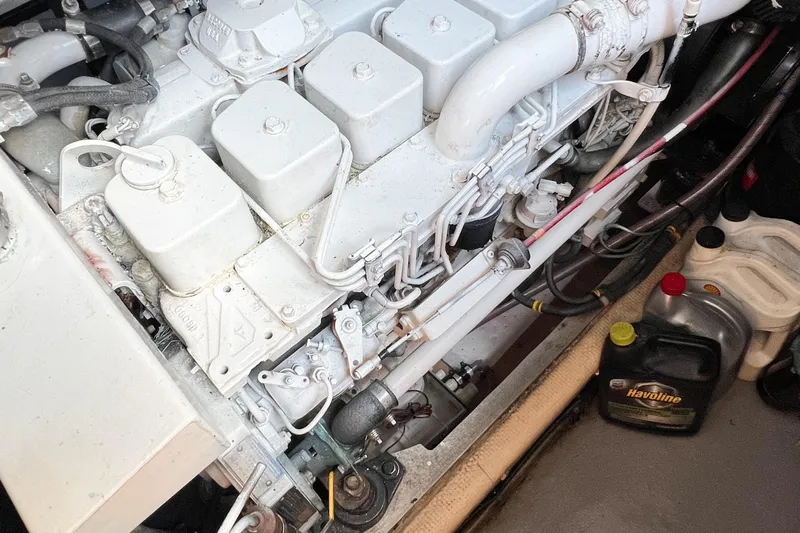 Mirage Yacht Photos Pics Engine compartment of a 1999 Nordic 32 with visible components and oil containers.