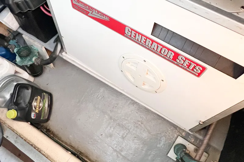 Mirage Yacht Photos Pics Nordic 32 boat engine room with generator and oil container, 1999 model.