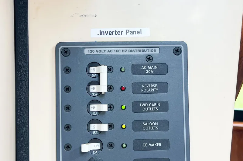 Mirage Yacht Photos Pics Inverter panel on Nordic 32, 1999 model, showing AC distribution and circuit breakers.