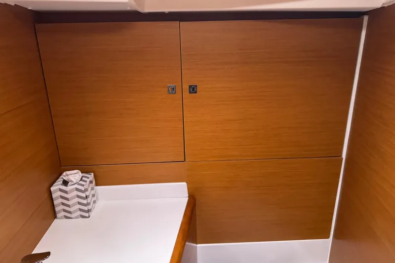 Kairos Yacht Photos Pics Interior of 2013 Jeanneau 409 sailboat with wooden cabinetry and countertop.