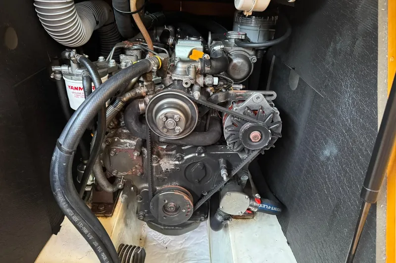 Kairos Yacht Photos Pics Engine compartment of a 2013 Jeanneau 409 sailboat, featuring a Yanmar engine.