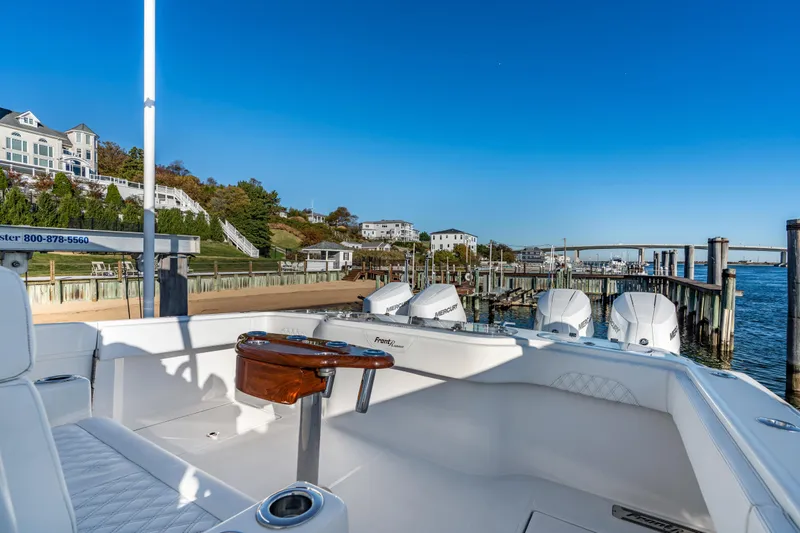  Yacht Photos Pics 2025 Front Runner 43 Catamaran docked at scenic marina with clear blue sky.