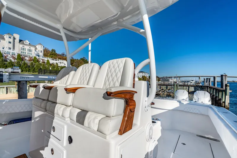  Yacht Photos Pics Luxurious seating on 2025 Front Runner 43 Catamaran, docked by scenic waterfront.