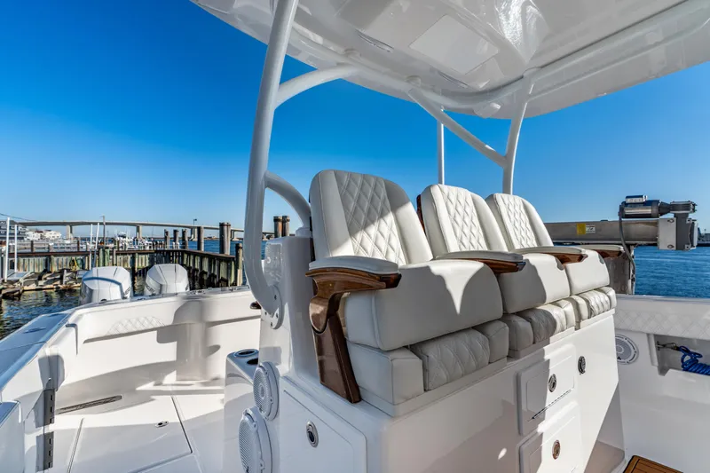  Yacht Photos Pics Luxurious seating on 2025 Front Runner 43 Catamaran, docked with clear blue sky backdrop.