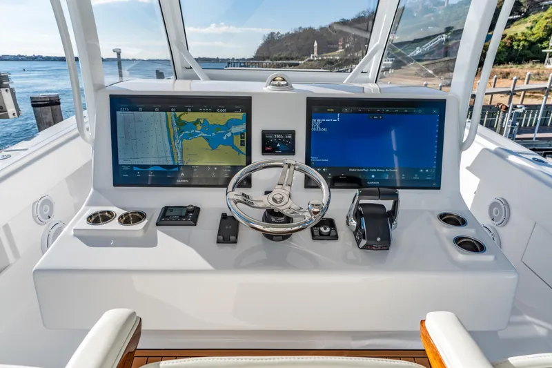  Yacht Photos Pics Helm of 2025 Front Runner 43 Catamaran with dual navigation screens and steering wheel.