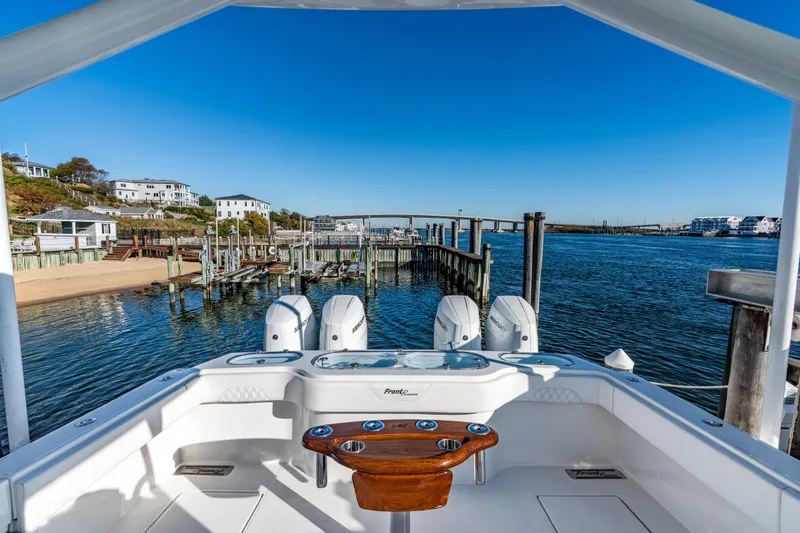  Yacht Photos Pics 2025 Front Runner 43 Catamaran docked at scenic waterfront with clear blue skies.