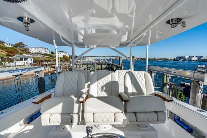  Yacht Photos Pics Luxurious seating on 2025 Front Runner 43 Catamaran, docked at a scenic marina.