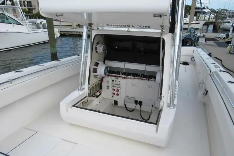  Yacht Photos Pics 2019 Contender 39 ST boat with open console showing electrical components at marina.