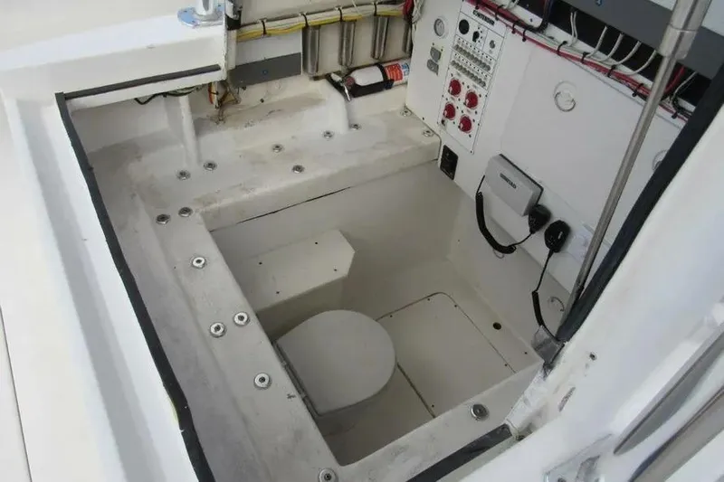  Yacht Photos Pics 2019 Contender 39 ST boat interior with control panel and storage area.