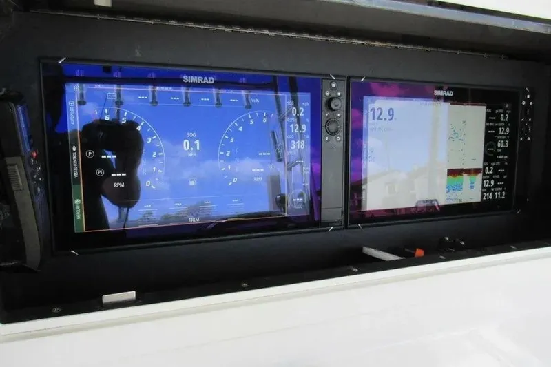  Yacht Photos Pics Simrad marine displays on 2019 Contender 39 ST boat dashboard, showing navigation and engine data.