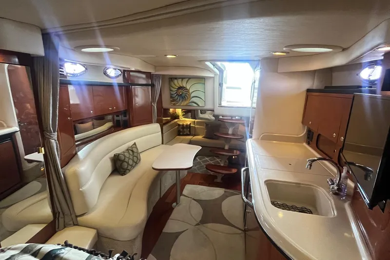 Chance Encounter Yacht Photos Pics Luxurious interior of a 2004 Sea Ray 340 Sundancer yacht with elegant seating and kitchenette.